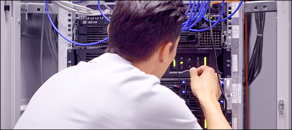 Network Repair man working on a server